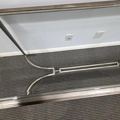 Sale Photo Thumbnail #185: Modern silver iron and glass sofa/entry table in excellent condition. The glass top is clean and clear without scratches. It measures 56"L x 20"D x 30"H.