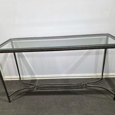 Sale Photo Thumbnail #180: Modern silver iron and glass sofa/entry table in excellent condition. The glass top is clean and clear without scratches. It measures 56"L x 20"D x 30"H.