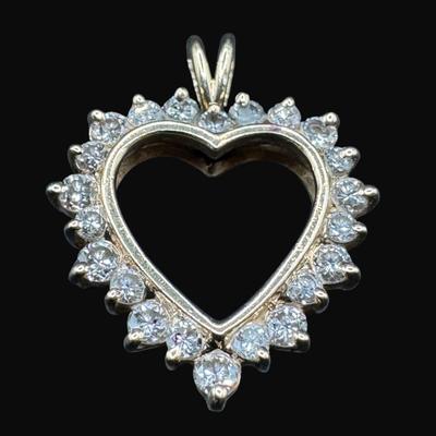 Sale Photo Thumbnail #361: **WIRE TRANSFER IS REQUIRED IF SHIPPED.** [3.37g] This diamond shaped pendant features 22 prong-set diamonds in yellow gold. Measurement: 1” x .75”.. Pre-auction estimate: $350-$450. **ALL PRECIOUS METALS SALES ARE FINAL. NO REFUNDS WILL BE GIVEN FOR 