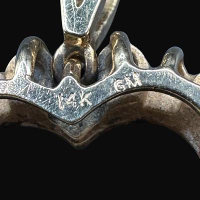 Sale Photo Thumbnail #362: **WIRE TRANSFER IS REQUIRED IF SHIPPED.** [3.37g] This diamond shaped pendant features 22 prong-set diamonds in yellow gold. Measurement: 1” x .75”.. Pre-auction estimate: $350-$450. **ALL PRECIOUS METALS SALES ARE FINAL. NO REFUNDS WILL BE GIVEN FOR 