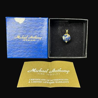 Sale Photo Thumbnail #445: **WIRE TRANSFER IS REQUIRED IF SHIPPED.** This lapis lazuli globe charm has 18K gold accents and findings. Measurement: 1”L (approximate). Gold content confirmed using Niton XRF precious metals analyzer. **ALL PRECIOUS METALS SALES ARE FINAL. NO REFUNDS