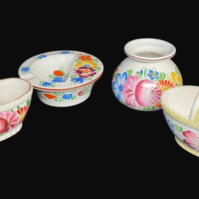 Sale Photo Thumbnail #461: Hand painted. Some pieces have “Chodovia” paper labels. Includes baskets, candle holders, bud vases, pitcher, and more. Total of ten pieces. Measurement of largest: 5”H. [RE]