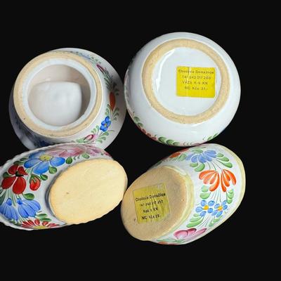 Sale Photo Thumbnail #462: Hand painted. Some pieces have “Chodovia” paper labels. Includes baskets, candle holders, bud vases, pitcher, and more. Total of ten pieces. Measurement of largest: 5”H. [RE]