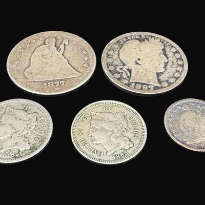 Sale Photo Thumbnail #470: **WIRE TRANSFER IS REQUIRED IF SHIPPED.** Includes two large cents (1833 and 1835); one 1865 two cent piece; one 1877 Seated Liberty quarter; one 1897 Barber quarter; two 1865 three cent pieces; and one 1859 Seated Liberty half dime. Total of eight pieces
