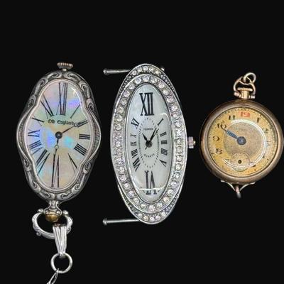 Sale Photo Thumbnail #502: Includes an Elgin pocket watch (Illinois Watch Case Co.), an Old England necklace watch without chain, and a Bijoux Terner watch without band. Total of three pieces. Not tested. [CS]