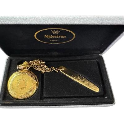 Sale Photo Thumbnail #517: Includes a Majestron pocket watch/knife combo, and a brass Danum hotel key from Doncaster. Total of two pieces. Watch not tested. [RM]