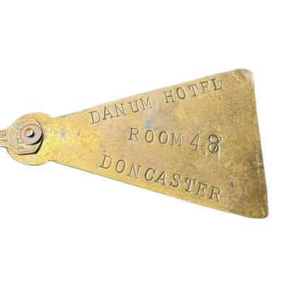 Sale Photo Thumbnail #518: Includes a Majestron pocket watch/knife combo, and a brass Danum hotel key from Doncaster. Total of two pieces. Watch not tested. [RM]