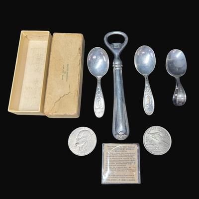 Sale Photo Thumbnail #523: Includes three infant spoons, a bottle opener, a 1971 Eisenhower dollar, and a Desert Storm coin. [RM]