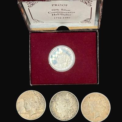 Sale Photo Thumbnail #526: **WIRE TRANSFER IS REQUIRED IF SHIPPED.** Includes a 1921 Morgan dollar, two 1924 Peace dollars, and a 1982 George Washington commemorative half dollar. Silver content is 90%. **ALL PRECIOUS METALS SALES ARE FINAL. NO REFUNDS WILL BE GIVEN FOR ANY REASON.