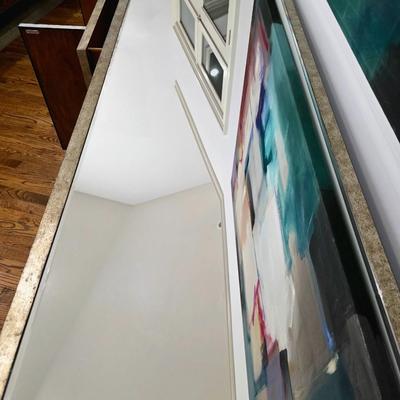 Sale Photo Thumbnail #205: This elegant, mirrored buffet/credenza cabinet is stunning and functional with lots of storage space. It measures 67"L x 34.5" H x 20"D. The cabinet is the only item you're bidding on, any other furniture or art you see in the photograph is NOT included.