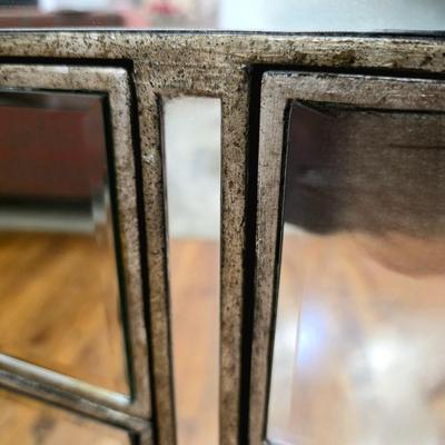 Sale Photo Thumbnail #204: This elegant, mirrored buffet/credenza cabinet is stunning and functional with lots of storage space. It measures 67"L x 34.5" H x 20"D. The cabinet is the only item you're bidding on, any other furniture or art you see in the photograph is NOT included.