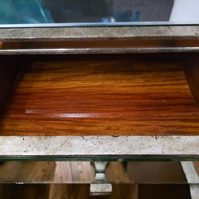 Sale Photo Thumbnail #202: This elegant, mirrored buffet/credenza cabinet is stunning and functional with lots of storage space. It measures 67"L x 34.5" H x 20"D. The cabinet is the only item you're bidding on, any other furniture or art you see in the photograph is NOT included.