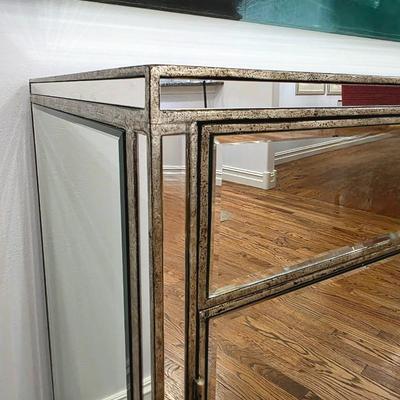 Sale Photo Thumbnail #199: This elegant, mirrored buffet/credenza cabinet is stunning and functional with lots of storage space. It measures 67"L x 34.5" H x 20"D. The cabinet is the only item you're bidding on, any other furniture or art you see in the photograph is NOT included.
