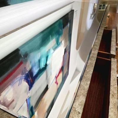 Sale Photo Thumbnail #206: This elegant, mirrored buffet/credenza cabinet is stunning and functional with lots of storage space. It measures 67"L x 34.5" H x 20"D. The cabinet is the only item you're bidding on, any other furniture or art you see in the photograph is NOT included.