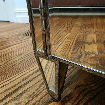 Sale Photo Thumbnail #207: This elegant, mirrored buffet/credenza cabinet is stunning and functional with lots of storage space. It measures 67"L x 34.5" H x 20"D. The cabinet is the only item you're bidding on, any other furniture or art you see in the photograph is NOT included.