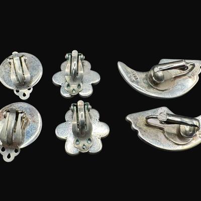 Sale Photo Thumbnail #546: **WIRE TRANSFER IS REQUIRED IF SHIPPED.** [21.84g] Includes Zuni style earrings, Navajo style earrings, and other Southwest style earrings. All are clip-ons. Measurement of largest: 1.25”. Silver content confirmed using Niton XRF precious metals analyze