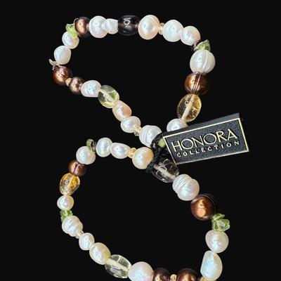 Sale Photo Thumbnail #548: Includes a bracelet with Baroque pearls and rhodonite, and a bracelet with Baroque pearls, colored pearls, and semi-precious stones. Includes original boxes and bags. [AG]