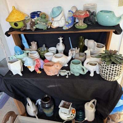 Sale Photo Thumbnail #169: Small planting Pots and water Cans

Wooden Flower Planter with hearts not included.