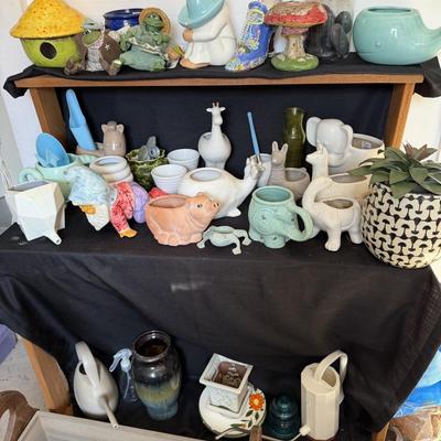 Sale Photo Thumbnail #171: Small planting Pots and water Cans

Wooden Flower Planter with hearts not included.