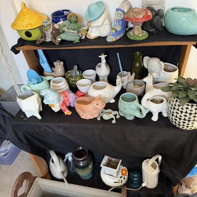 Sale Photo Thumbnail #170: Small planting Pots and water Cans

Wooden Flower Planter with hearts not included.