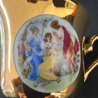 Sale Photo Thumbnail #555: Service for six. Includes a tea pot, creamer, sugar (no lid), cups, and saucers. [RE]