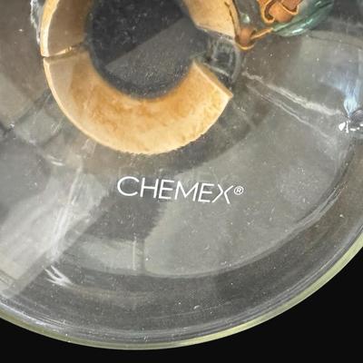 Sale Photo Thumbnail #578: Includes a Chemex pour over coffee maker, an Italian glass bottle, a medium pitcher, Waterford Marquis, and more. Total of seven pieces. Measurement of tallest: 9”H. [CS]