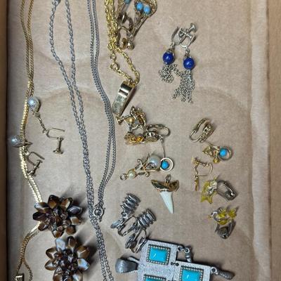 Sale Photo Thumbnail #586: Includes gold tone and silver tone pieces: earrings, necklaces, charms, bracelets, and more. [CS]