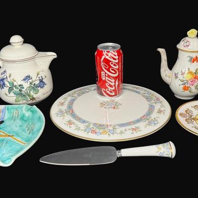 Sale Photo Thumbnail #603: Includes a Royal Worcester cake plate and server, Buckingham Palace English china, Herend Hungary hand painted coffee pot, and a Villeroy & Boch porcelain tea pot. Total of six pieces. Measurement of largest: 11” Diameter. [CS]