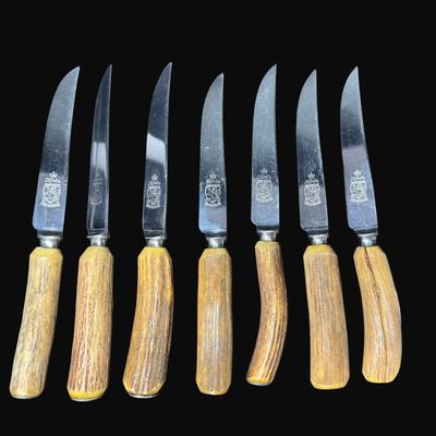 Sale Photo Thumbnail #615: Steak knives with horn handles. Made in Sheffield, England. Total of seven pieces. Measurement: 8.5”L (each). [CS]