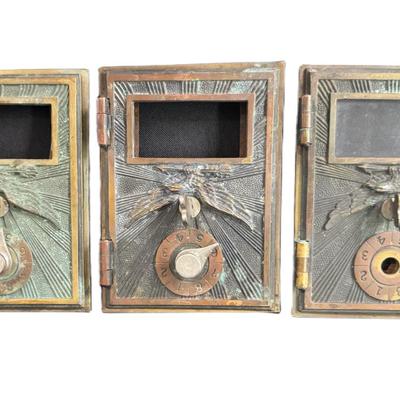 Sale Photo Thumbnail #621: All pieces feature the Flying Eagle motif, and have single dial combination locks. Total of three pieces. Measurement: 5” x 4” (each). [CS]