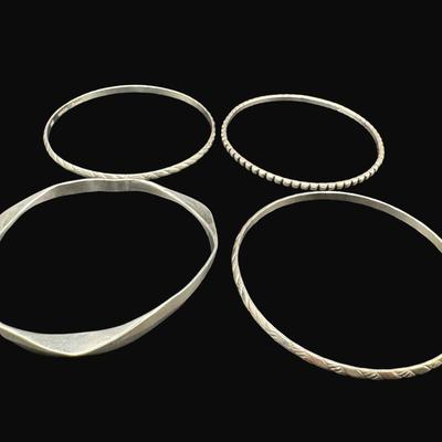 Sale Photo Thumbnail #626: **WIRE TRANSFER IS REQUIRED IF SHIPPED.** [42.12g] Includes four bangle bracelets with various patterns, including mid-century style. Silver content confirmed using Niton XRF precious metals analyzer. **ALL PRECIOUS METALS SALES ARE FINAL. NO REFUNDS WILL