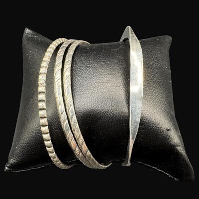 Sale Photo Thumbnail #625: **WIRE TRANSFER IS REQUIRED IF SHIPPED.** [42.12g] Includes four bangle bracelets with various patterns, including mid-century style. Silver content confirmed using Niton XRF precious metals analyzer. **ALL PRECIOUS METALS SALES ARE FINAL. NO REFUNDS WILL