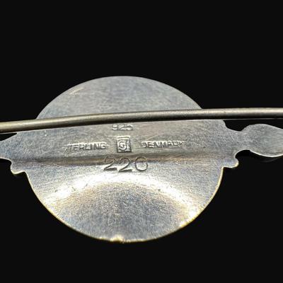 Sale Photo Thumbnail #630: **WIRE TRANSFER IS REQUIRED IF SHIPPED.** [25.92g] Includes a Danish ship design pin, a Far Fetched Co. pin with gold vermeil, and an Arabic sword pin. Total of three pieces. There is age related wear to the sword pin. Measurement of largest: 2.5”. Silv