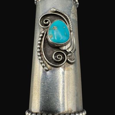 Sale Photo Thumbnail #639: **WIRE TRANSFER IS REQUIRED IF SHIPPED.** [29.81g] This cigarette lighter case features a turquoise cabochon, along with a high relief Navajo design. **ALL PRECIOUS METALS SALES ARE FINAL. NO REFUNDS WILL BE GIVEN FOR ANY REASON.** [RM]