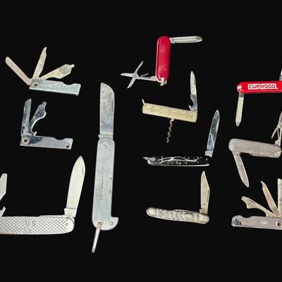 Sale Photo Thumbnail #646: Includes U.S. Gov’t., Victronox, Trim, and more. Total of 11 pieces. Measurement of longest: 7” (open). [CS]