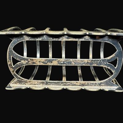 Sale Photo Thumbnail #667: Includes a vintage English toast rack, a vintage Wear-Ever aluminum milk jug, and an antique English tea pot. Total of three pieces. Measurement of tallest: 8.5”H. [CS]