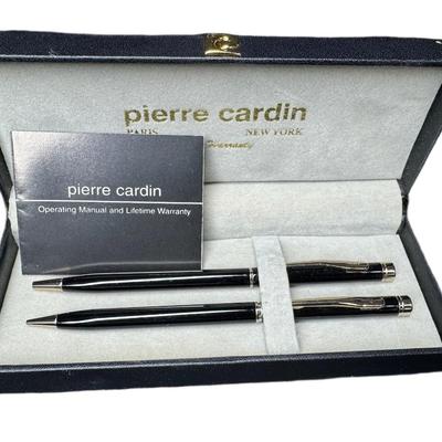 Sale Photo Thumbnail #673: Includes a Pierre Cardin pen and pencil set, a chromed Bill Blass pen and pencil set, and a Waterford crystal desk pen. Total of three pieces. [CS]