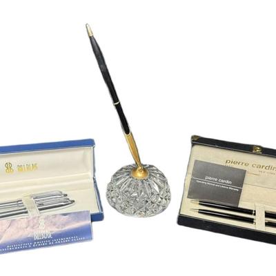 Sale Photo Thumbnail #671: Includes a Pierre Cardin pen and pencil set, a chromed Bill Blass pen and pencil set, and a Waterford crystal desk pen. Total of three pieces. [CS]