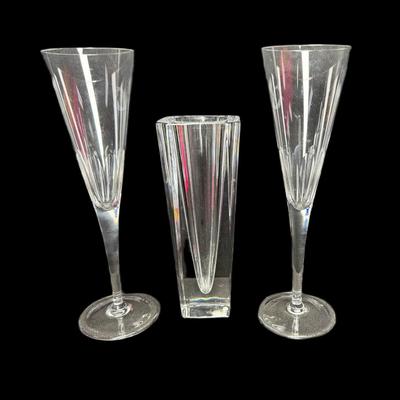 Sale Photo Thumbnail #693: Includes a pair of Tiffany & Co. toasting flutes, and an Orrefors Odyssey square vase. Total of three pieces. Measurement of largest: 9”H. [CS]