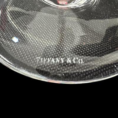 Sale Photo Thumbnail #695: Includes a pair of Tiffany & Co. toasting flutes, and an Orrefors Odyssey square vase. Total of three pieces. Measurement of largest: 9”H. [CS]