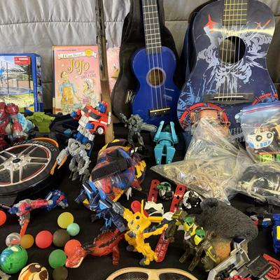 Sale Photo Thumbnail #206: Toys and toys, Guitar, Ukelele, Transformers, and more.