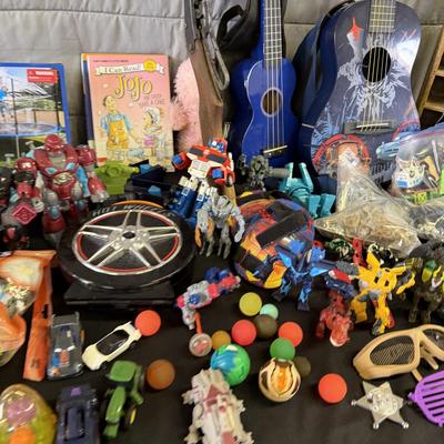 Sale Photo Thumbnail #203: Toys and toys, Guitar, Ukelele, Transformers, and more.