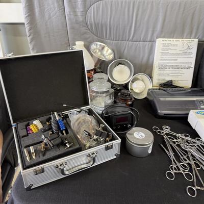 Sale Photo Thumbnail #236: Lot of Tattoo Supplies Lights, Tracers, books and more.