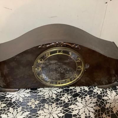 Sale Photo Thumbnail #187: This isa wood mantle clock. Has the key to wind it, but is missing clock hands and back door.