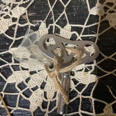 Sale Photo Thumbnail #189: This isa wood mantle clock. Has the key to wind it, but is missing clock hands and back door.