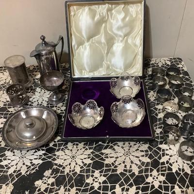 Sale Photo Thumbnail #247: You get 13 silver napkins rings, three nut cups in a great case. You also get silver round tray, silver cup, silver lid, and other items.