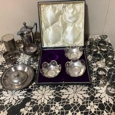 Sale Photo Thumbnail #248: You get 13 silver napkins rings, three nut cups in a great case. You also get silver round tray, silver cup, silver lid, and other items.