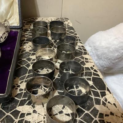 Sale Photo Thumbnail #250: You get 13 silver napkins rings, three nut cups in a great case. You also get silver round tray, silver cup, silver lid, and other items.