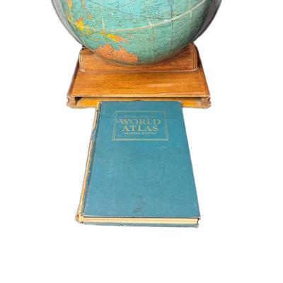 Sale Photo Thumbnail #720: This piece includes the original 1943 Rand McNally World Atlas Readers Edition. Age related wear. The base is believed to be mahogany. [CS]