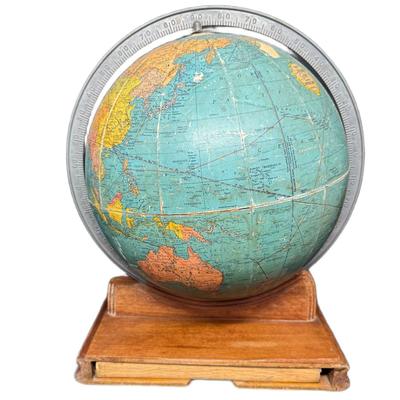 Sale Photo Thumbnail #719: This piece includes the original 1943 Rand McNally World Atlas Readers Edition. Age related wear. The base is believed to be mahogany. [CS]
